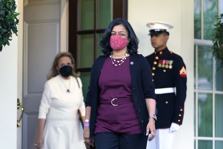 Rep. Pramila Jayapal, D-Wash., the chair of the Congressional Progressive Caucus, center, walks out of the West Wing of the White House in Washington, Tuesday, Oct. 19, 2021, to talk with reporters following a meeting with President Joe Biden. Rep Debbie Dingell, D-Mich., follows at left. (AP Photo/Susan Walsh)