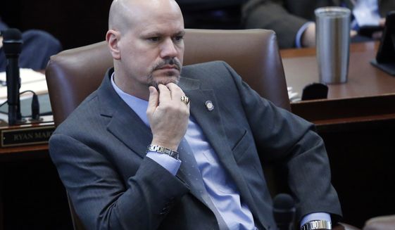 In this Jan. 5, 2017, file photo, Oklahoma state Rep. Kevin West, R-Moore, listens on the floor of the Oklahoma House in Oklahoma City. On Tuesday, Oct. 19, 2021, a group of Oklahoma students and educators filed a federal lawsuit challenging the constitutionality of a law that bans the teaching of certain concepts of race and racism. Oklahoma&#x27;s legislation was sponsored by West. (AP Photo/Sue Ogrocki File)