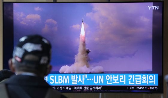 A man watches a TV screen showing an image of North Korea&#39;s ballistic missile launched from a submarine during a news program at Seoul Railway Station in Seoul, South Korea, Wednesday, Oct. 20, 2021. North Korea announced Wednesday that it had tested a newly developed missile designed to be launched from a submarine, the first such weapons test in two years and one it says will bolster its military&#39;s underwater operational capability. Korean letters read: &quot;North Korea launched a Submarine-Launched Ballistic Missile and U.N. security council emergency meeting.&quot; (AP Photo/Ahn Young-joon)