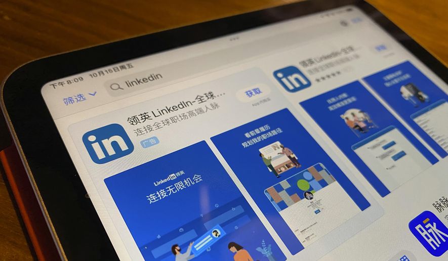 The internet App Store page showing the Chinese LinkedIn app is displayed on a device in Beijing, China, Friday, Oct. 15, 2021. Microsoft is shutting down its main LinkedIn service in China later this year as Beijing tightens its internet rules. (AP Photo/Ng Han Guan)