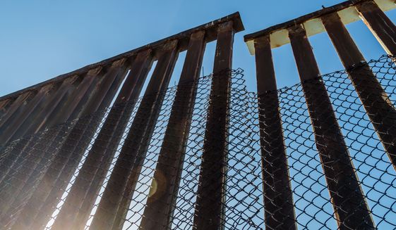 A section of the border fence separating San Diego, California and Tijuana, Mexico. Photo credit: Sherry V. Smith via Shutterstock