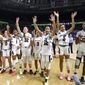 FILE - In this March 6, 2020, file photo, South Carolina players celebrate after defeating Georgia 89-56 in a quarterfinal match at the Southeastern women&#39;s NCAA college basketball tournament in Greenville, S.C. Dawn Staley and South Carolina are back in a familiar spot: No. 1 in The Associated Press Top 25 women&#39;s basketball poll, released Tuesday, Oct. 19, 2021.(AP Photo/Richard Shiro, File) **FILE**