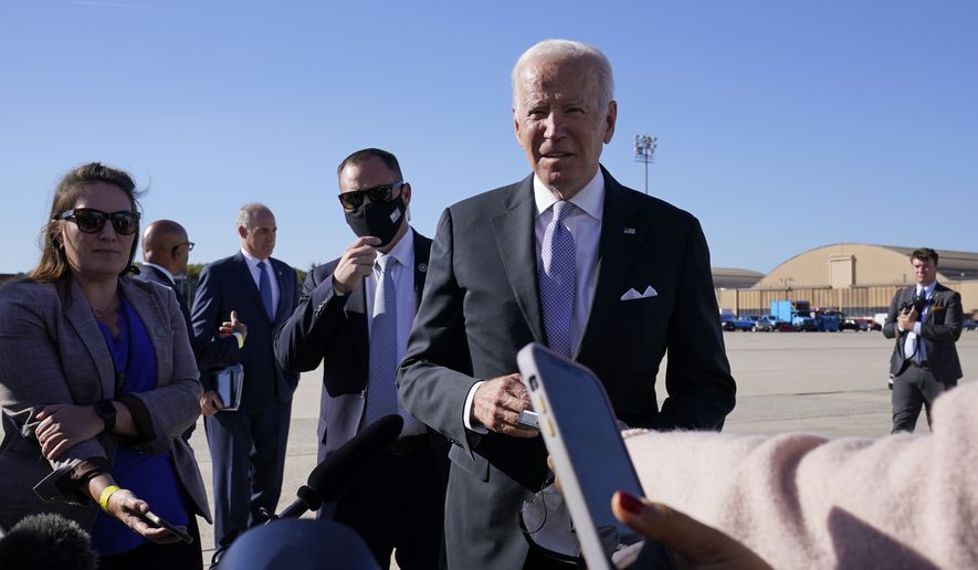 President Joe Biden stops to talk with reporters before boarding Air Force One at Andrews Air Force Base, Md., Wednesday, Oct. 20, 2021. Biden is traveling to his hometown of Scranton, Pa., to talk about infrastructure and his domestic agenda. (AP Photo/Susan Walsh)