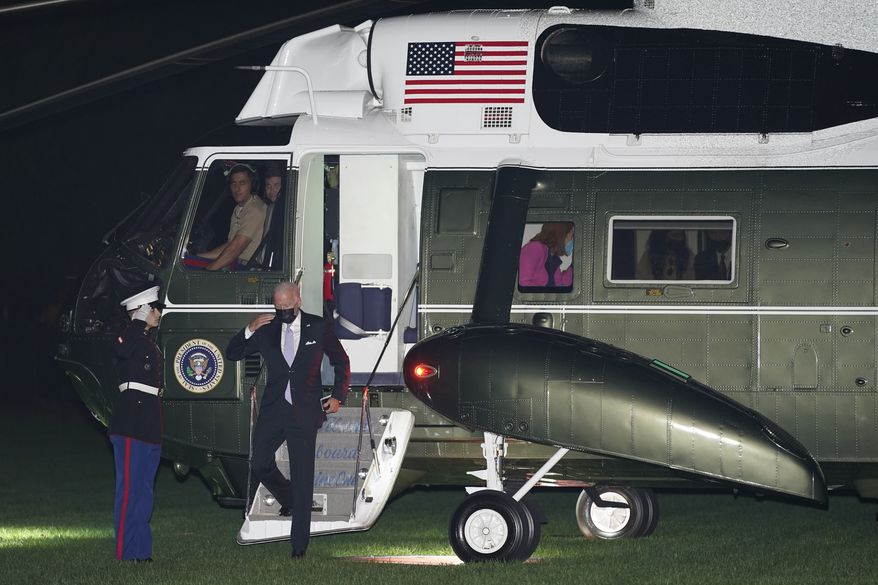 President Joe Biden salutes as he steps off Marine One on the South Lawn of the White House in Washington, Wednesday, Oct. 20, 2021. Biden is returning from an event to promote his domestic spending package in Scranton, Pa. (AP Photo/Patrick Semansky)
