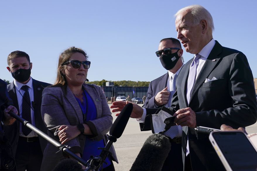 President Joe Biden speaks to reporters before boarding Air Force One at Andrews Air Force Base, Md., Wednesday, Oct. 20, 2021. Biden is traveling to his hometown of Scranton, Pa., to talk about infrastructure and his domestic agenda. (AP Photo/Susan Walsh)