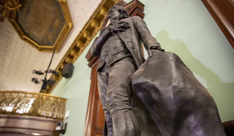 A statue of Thomas Jefferson holding the Declaration of Independence stands in New York&#39;s City Hall Council Chamber on Wednesday, October 20, 2021. The 1833 statue of Jefferson will be removed from the council chamber by the end of the year. Some New York City Council members have called for years to remove the statue from the room where they conduct business because Jefferson was a slaveholder. (AP Photo/Ted Shaffrey)