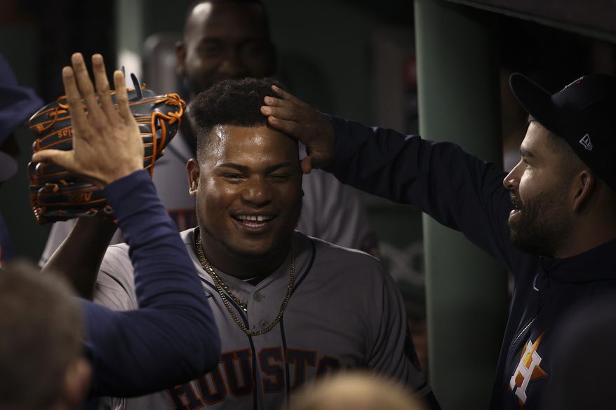 Houston Astros starting pitcher Framber Valdez celebrates in the dugout after the eighth inning in Game 5 of baseball&#39;s American League Championship Series against the Boston Red Sox Wednesday, Oct. 20, 2021, in Boston. (AP Photo/Winslow Townson)