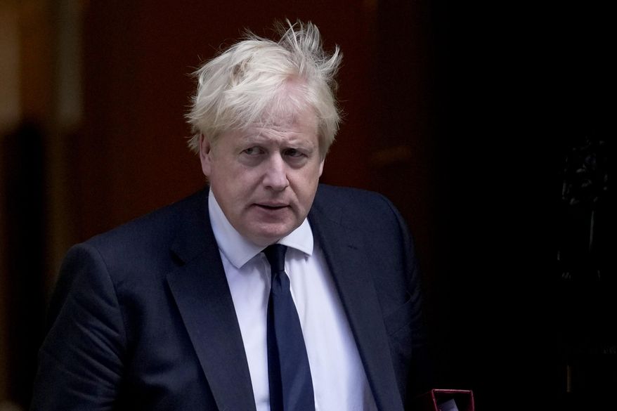 British Prime Minister Boris Johnson leaves 10 Downing Street to attend the weekly Prime Minister&#39;s Questions at the Houses of Parliament, in London, Wednesday, Oct. 20, 2021. (AP Photo/Matt Dunham)