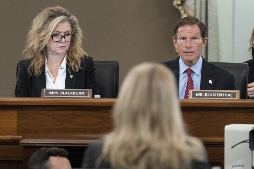 FILE - Sen. Marsha Blackburn, R-Tenn., left, and Sen. Richard Blumenthal, D-Conn., right speak to former Facebook data scientist Frances Haugen, center, during a hearing of the Senate Commerce, Science, and Transportation Subcommittee on Consumer Protection, Product Safety, and Data Security, on Capitol Hill, Tuesday, Oct. 5, 2021, in Washington. Blumenthal, who heads the Senate Commerce subcommittee on consumer protection, called in a sharply worded letter Wednesday, Oct. 20, for Facebook founder, Mark Zuckerberg, to testify before the panel on Instagram’s effects on children. (AP Photo/Alex Brandon, File)