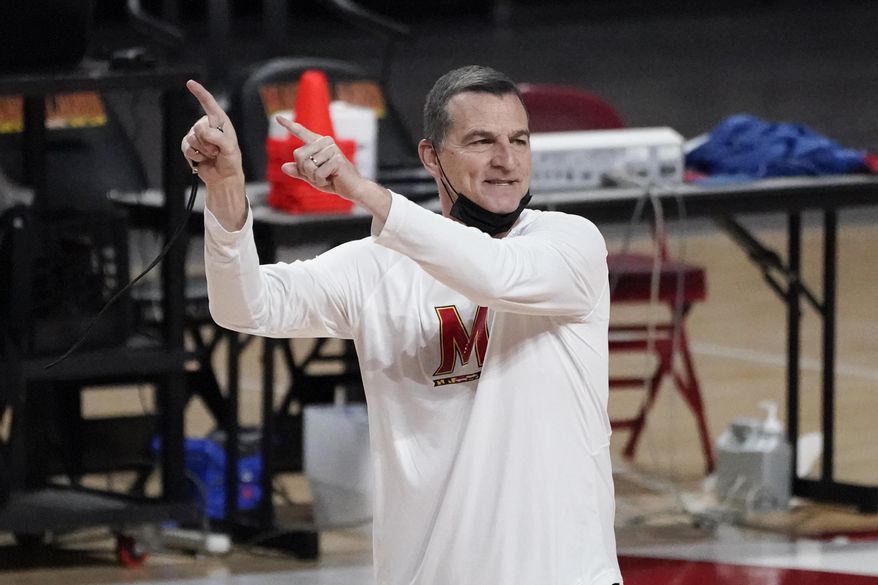 Maryland head coach Mark Turgeon talks to his team during a workout at the team's NCAA college basketball media day, Tuesday, Oct. 12, 2021, in College Park, Md. (AP Photo/Julio Cortez) **FILE**