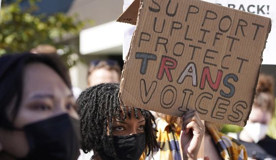 People protest outside the Netflix at Vine building in the Hollywood section of Los Angeles, in this Wednesday, Oct. 20, 2021, file photo. (AP Photo/Damian Dovarganes) ** FILE **