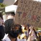 People protest outside the Netflix at Vine building in the Hollywood section of Los Angeles, in this Wednesday, Oct. 20, 2021, file photo. (AP Photo/Damian Dovarganes) ** FILE **