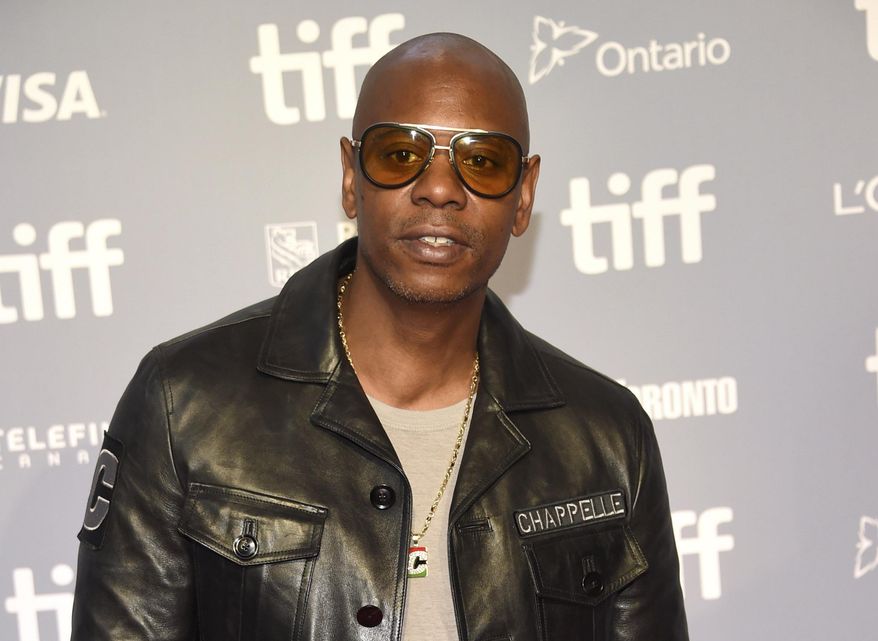 FILE - Actor-comedian Dave Chappelle attends the press conference for &amp;quot;A Star Is Born&amp;quot; at the Toronto International Film Festival in Toronto on Sept. 9, 2018. Critics and supporters of Chappelle’s Netflix special that included anti-transgender comments gathered outside the company’s offices Wednesday, Oct. 20, 2021, with “Trans Lives Matter” and “Free Speech is a Right” among their competing messages. (Photo by Evan Agostini/Invision/AP, File)