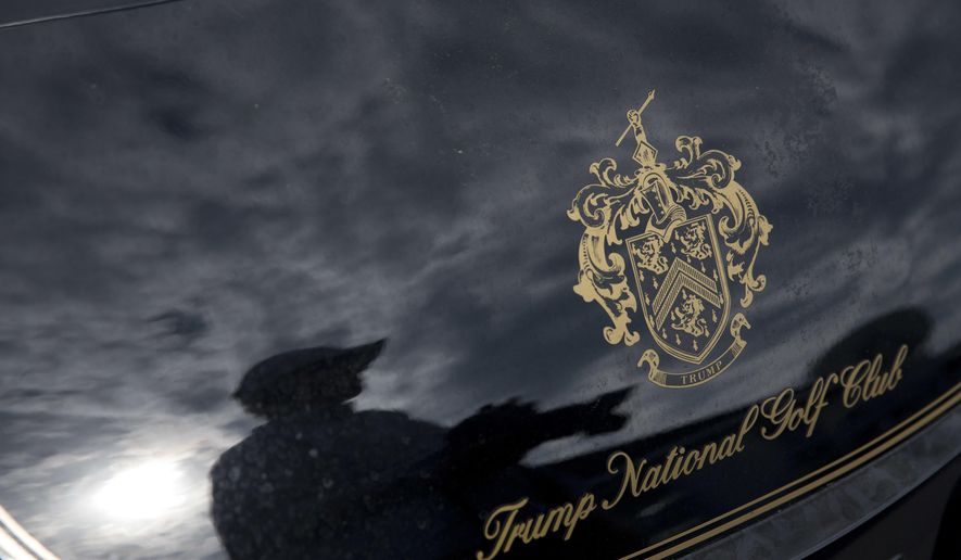 In this June 7, 2016, file photo, a photographer is reflected in a golf cart at the the Trump National Golf Club Westchester in Briarcliff Manor, N.Y. ( Photo/Mary Altaffer, File)