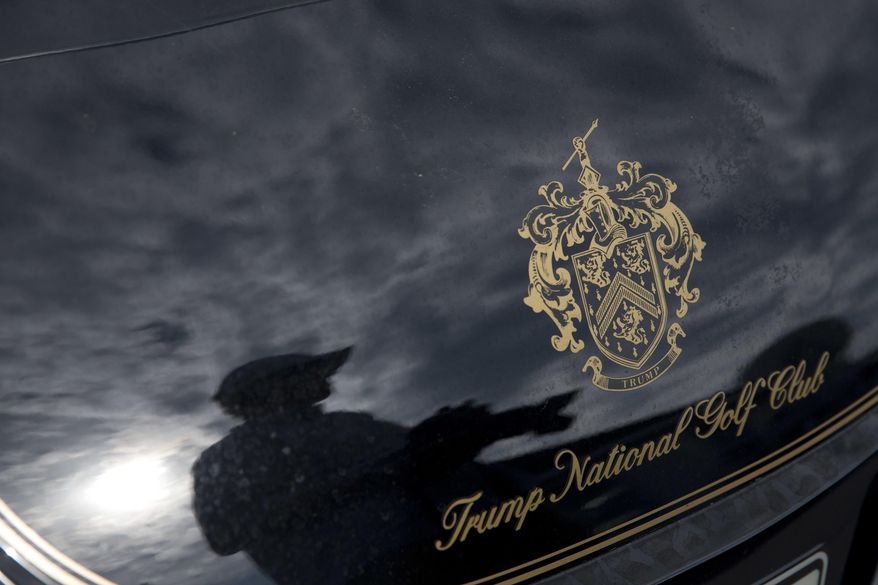 In this June 7, 2016, file photo, a photographer is reflected in a golf cart at the the Trump National Golf Club Westchester in Briarcliff Manor, N.Y. ( Photo/Mary Altaffer, File)