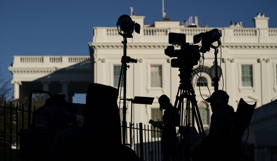 Media organizations set up outside the White House. (AP Photo/Evan Vucci)