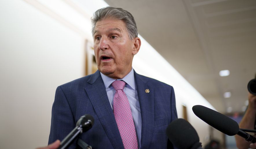 In this Oct. 5, 2021, photo, Sen. Joe Manchin, D-W.Va., talks to reporters as he arrives to chair the Senate Energy and Natural Resources Committee at the Capitol in Washington. (AP Photo/J. Scott Applewhite) **FILE**