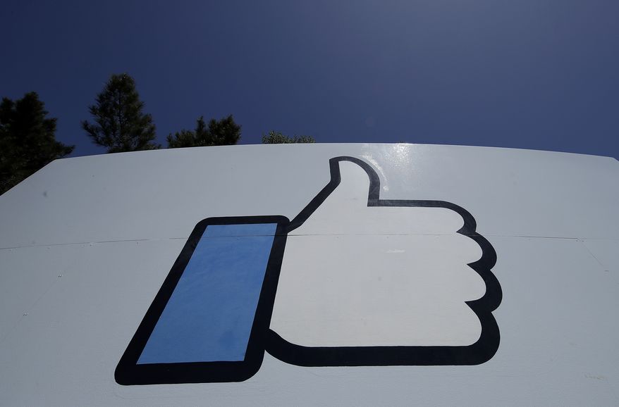 This April 25, 2019, file photo shows the thumbs-up &quot;Like&quot; logo on a sign at Facebook headquarters in Menlo Park, Calif. Amid a crush of bad publicity, governmental scrutiny and growing competition for its social media business, the company is hiring workers and making products to create the “metaverse,&quot; essentially a new computing platform and “a new phase of interconnected virtual experiences using technologies like virtual and augmented reality,&quot; according to company officials. (AP Photo/Jeff Chiu, File)  **FILE**