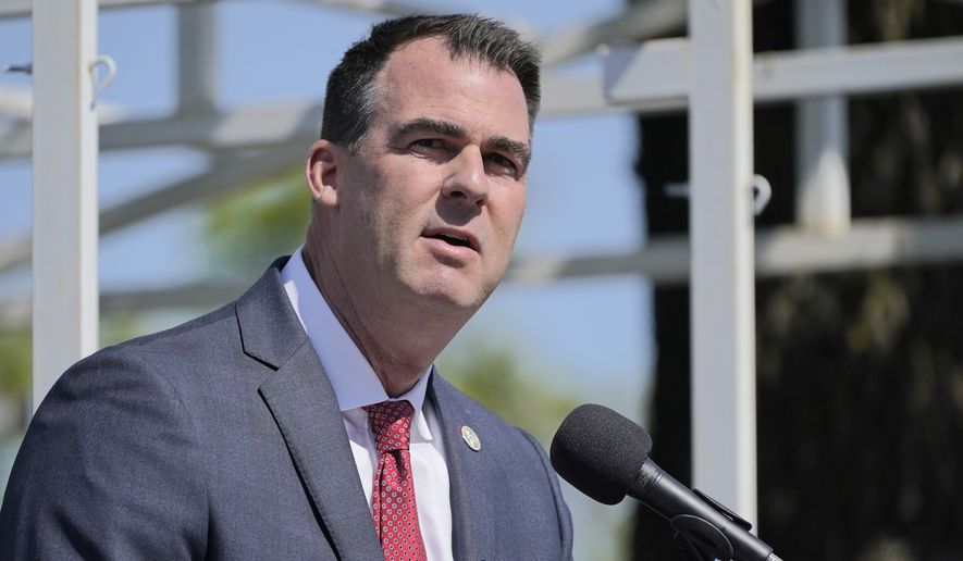 In this Friday, May 7, 2021 file photo, Oklahoma Gov. Kevin Stitt speaks during a ceremony, in Oklahoma City. Mr. Stitt signed into law a measure that bans teaching of Critical Race Theory in the state&#39;s public schools, prompting a lawsuit to thwart its implementation. Conservative Oklahoma legislators have responded to criticism from the left by saying the lawsuit mischaracterizes the language of the bill and predicting that courts will reject the challenge.  (AP Photo/Sue Ogrocki, File)  **FILE**