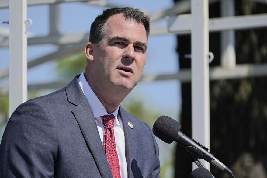 In this Friday, May 7, 2021 file photo, Oklahoma Gov. Kevin Stitt speaks during a ceremony, in Oklahoma City. Mr. Stitt signed into law a measure that bans teaching of Critical Race Theory in the state&#x27;s public schools, prompting a lawsuit to thwart its implementation. Conservative Oklahoma legislators have responded to criticism from the left by saying the lawsuit mischaracterizes the language of the bill and predicting that courts will reject the challenge.  (AP Photo/Sue Ogrocki, File)  **FILE**