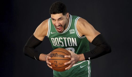 Boston Celtics center Enes Kanter yells for a photo during the Boston Celtics Media Day, Monday, Sept. 27, 2021, in Canton, Mass. (AP Photo/Mary Schwalm)