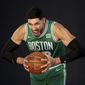 Boston Celtics center Enes Kanter yells for a photo during the Boston Celtics Media Day, Monday, Sept. 27, 2021, in Canton, Mass. (AP Photo/Mary Schwalm)