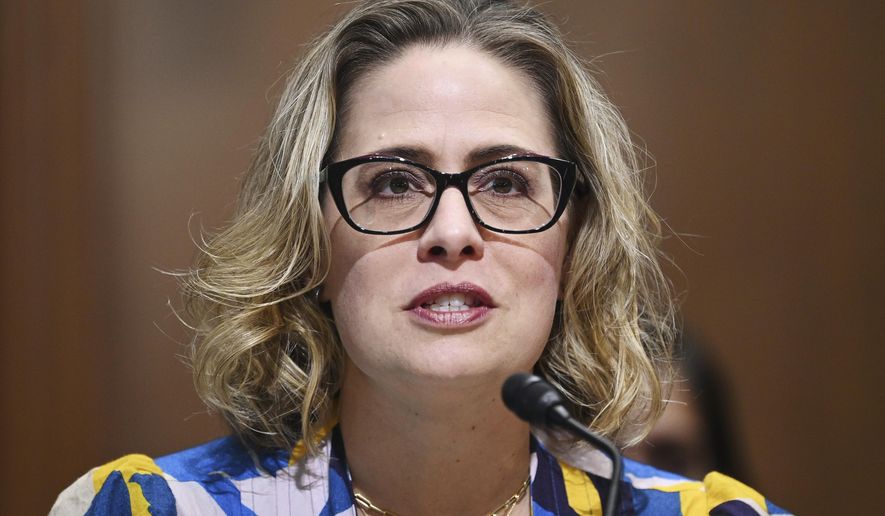 In this Oct. 19, 2021 file photo, Sen. Kyrsten Sinema, D-Ariz., speaks during a committee hearing on Capitol Hill in Washington. Democratic Arizona Sen. Sinema faced more defections Thursday, Oct. 21, 2021, from the broad base of support she built to win her seat in 2018 when five members of her veterans advisory council resigned over her opposition to parts of President Joe Biden&#x27;s infrastructure plan and refusal to ditch the Senate filibuster. (Mandel Ngan/Pool via AP, File)