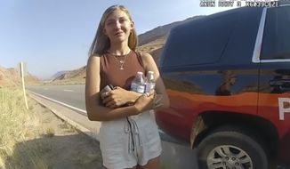 This police camera video provided by The Moab Police Department shows Gabrielle &quot;Gabby&quot; Petito talking to a police officer after police pulled over the van she was traveling in with her boyfriend. The FBI on Thursday, Oct. 21, 2021, identified human remains found in a Florida nature preserve as those of Brian Laundrie, a person of interest in the death of girlfriend Gabby Petito while the couple was on a cross-country road trip. (The Moab Police Department via AP) ** FILE **