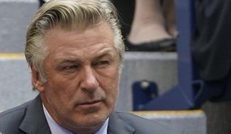 FILE - In this Sunday, Sept. 12, 2021, photo Alec Baldwin watches the men&#39;s singles final of the US Open tennis championships in New York. A prop firearm discharged by veteran actor Alec Baldwin, who is starring and producing a Western movie, killed his director of photography and injured the director Thursday, Oct. 21, 2021 at the movie set outside Santa Fe, N.M., the Santa Fe County Sheriff’s Office said.(AP Photo/John Minchillo, File)