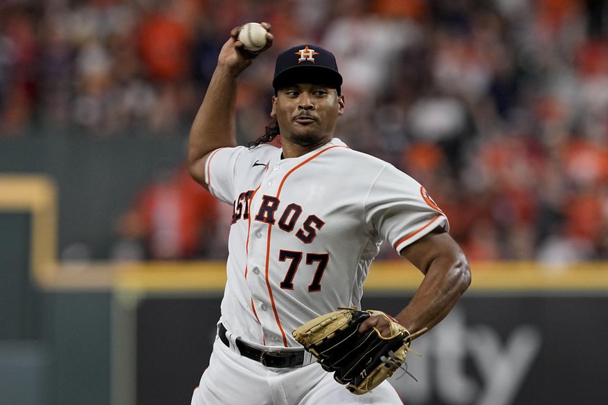 Houston Astros starting pitcher Luis Garcia throws against the Boston Red Sox during the first inning in Game 6 of baseball&#x27;s American League Championship Series Friday, Oct. 22, 2021, in Houston. (AP Photo/Tony Gutierrez)