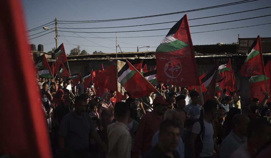 In this June 2, 2021, file photo, Palestinians attend a rally organized by the Popular Front for the Liberation of Palestine (PFLP), in Gaza City. (AP Photo/Felipe Dana, File)