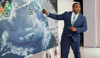 Co-anchor and meteorologist Jason Frazer rehearses on the Fox Weather set at News Corporation headquarters in New York, Wednesday, Oct. 20, 2021. Fox Weather, a free streaming service and app, will launch on Monday. (AP Photo/Richard Drew)