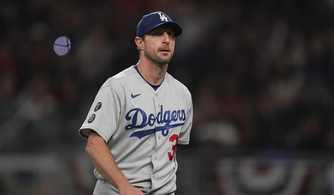 Los Angeles Dodgers starting pitcher Max Scherzer walks off the field after being relieved in the fifth inning in Game 2 of baseball&#x27;s National League Championship Series against the Atlanta Braves Sunday, Oct. 17, 2021, in Atlanta. (AP Photo/Brynn Anderson) **FILE**