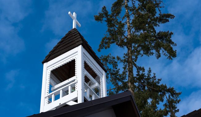 Church bell tower in a blue sky. Photo Credit: Richard Nantais via Shutterstock. ** FILE **