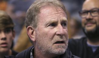 In this Dec. 11, 2019, file photo, Phoenix Suns owner Robert Sarver watches the team play against the Memphis Grizzlies during the second half of an NBA basketball game in Phoenix. The Suns released a statement regarding a potential media investigation into the workplace culture of the franchise, denying that the organization or Sarver has a history of racism or sexism. The statement sent Friday, Oct. 22, 2021, said the organization is aware that ESPN is working on a story accusing the organization of misconduct on a “variety of topics.” The Suns responded by saying they were “completely baseless claims” and “documentary evidence in our possession and eyewitness accounts directly contradict the reporter’s accusations, and we are preparing our response to his questions.” (AP Photo/Ross D. Franklin, File) **FILE**