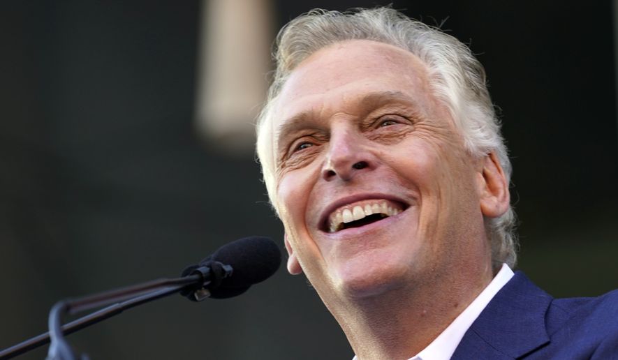 Democratic gubernatorial candidate, former Virginia Gov. Terry McAuliffe smiles during a rally in Richmond, Va., Saturday, Oct. 23, 2021. McAuliffe will face Republican Glenn Youngkin in the November election. (AP Photo/Steve Helber)