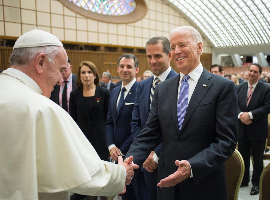In this April 29, 2016, photo, Pope Francis shakes hands with then-Vice President Joe Biden as he takes part at a congress on the progress of regenerative medicine and its cultural impact, being held in the Pope Paul VI hall at the Vatican. (Pablo Martinez Monsivais/L&#39;Osservatore Romano/Pool photo via AP) **FILE**