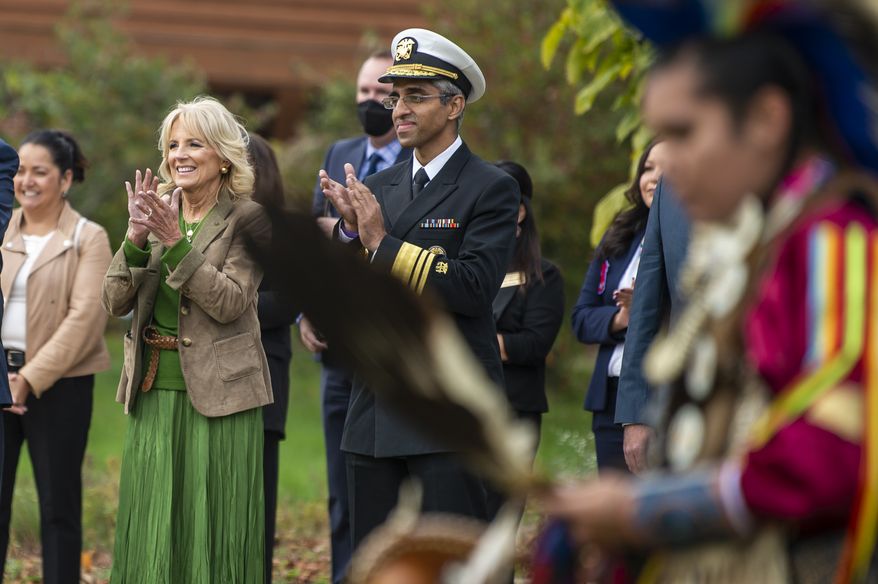 First lady Jill Biden claps after a dancing performance during her visit to the Ziibiwing Center in Mount Pleasant, Mich. for a listening session focused on youth mental health with members of the Saginaw Chippewa Indian Tribe on Sunday, Oct. 24, 2021. (Kaytie Boomer/The Bay City Times via AP)
