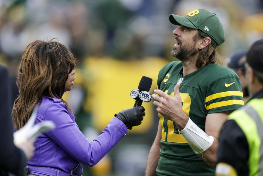 Green Bay Packers&#39; Aaron Rodgers is interviewed after an NFL football game against the Washington Football Team Sunday, Oct. 24, 2021, in Green Bay, Wis. The Packers won 24-10. (AP Photo/Matt Ludtke)