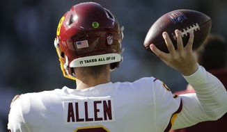 Washington Football Team&#39;s Kyle Allen warms up before an NFL football game against the Green Bay Packers Sunday, Oct. 24, 2021, in Green Bay, Wis. (AP Photo/Aaron Gash)