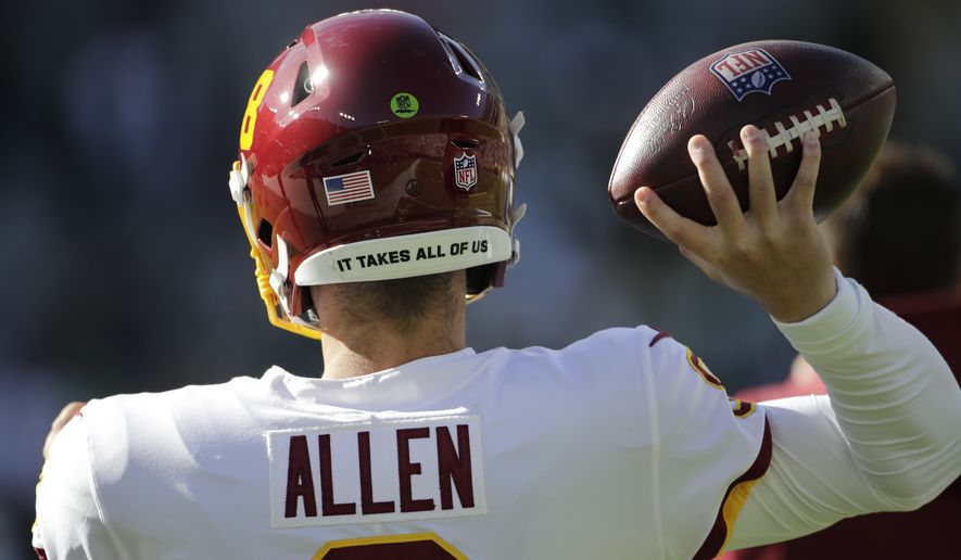 Washington Football Team&#x27;s Kyle Allen warms up before an NFL football game against the Green Bay Packers Sunday, Oct. 24, 2021, in Green Bay, Wis. (AP Photo/Aaron Gash)