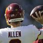 Washington Football Team&#39;s Kyle Allen warms up before an NFL football game against the Green Bay Packers Sunday, Oct. 24, 2021, in Green Bay, Wis. (AP Photo/Aaron Gash)