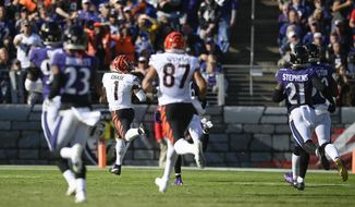 Cincinnati Bengals wide receiver Ja&#39;Marr Chase (1) runs away for a long touchdown after making a catch during the second half of an NFL football game, Sunday, Oct. 24, 2021, in Baltimore. (AP Photo/Nick Wass)