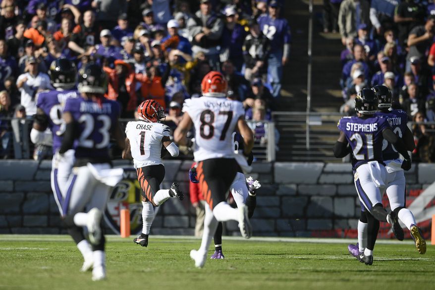 Cincinnati Bengals wide receiver Ja&#39;Marr Chase (1) runs away for a long touchdown after making a catch during the second half of an NFL football game, Sunday, Oct. 24, 2021, in Baltimore. (AP Photo/Nick Wass)