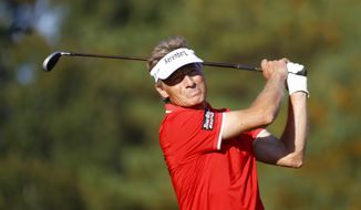 Bernhard Langer watches his tee shot in the 17th hole during the last day of the Dominion Energy Charity Classic golf tournament at Country Club of Virginia on Sunday, Oct. 24, 2021, in Richmond, Va. (Daniel Sangjib Min/Richmond Times-Dispatch via AP)