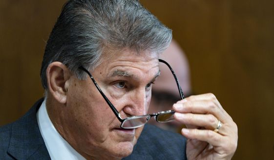 Sen. Joe Manchin, D-W.Va., a key holdout vote on President Joe Biden&#39;s domestic agenda, chairs a hearing of the Senate Energy and Natural Resources Committee, at the Capitol in Washington, Tuesday, Oct. 19, 2021. (AP Photo/J. Scott Applewhite)