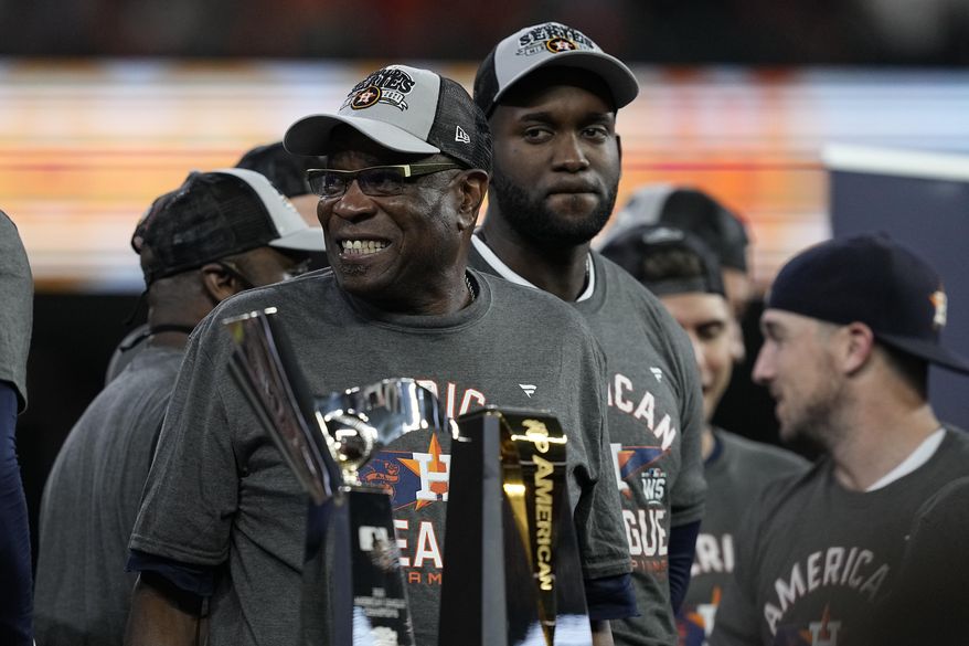 Houston Astros manager Dusty Baker Jr. stands by the trophy after their win against the Boston Red Sox in Game 6 of baseball&#x27;s American League Championship Series Friday, Oct. 22, 2021, in Houston. The Astros won 5-0, to win the ALCS series in game six.(AP Photo/Tony Gutierrez) **FILE**