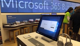 In this Jan. 28, 2020, photo, a Microsoft computer is among items displayed at a Microsoft store in suburban Boston. Microsoft says the same Russia-backed hackers responsible for the 2020 SolarWinds breach continue to attack the global technology supply chain and are have been relentlessly targeting cloud service resellers and others since summer. (AP Photo/Steven Senne) **FILE**