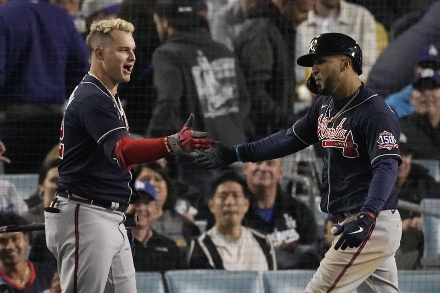 Atlanta Braves&#39; Eddie Rosario, right, is congratulated by Atlanta Braves&#39; Joc Pederson after hitting a two-run home run in the ninth inning against the Los Angeles Dodgers in Game 4 of baseball&#39;s National League Championship Series Wednesday, Oct. 20, 2021, in Los Angeles. (AP Photo/Marcio Jose Sanchez) **FILE**