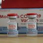 In this Sunday, Aug. 15, 2021 file photo, vials of the Moderna COVID-19 vaccine are seen at the Assad Iben El Fourat school in Oued Ellil, outside Tunisa. The European Medicines Agency said a booster dose of Moderna’s coronavirus vaccine “can be considered” in people aged 18 and above. In a statement on Monday, Oct. 25, the EU drug regulator said its analysis had shown that a third dose given of Moderna’s vaccine - which is usually given in a two-dose schedule - at least six months after the second dose, led to an increase in antibody levels in adults whose levels were waning. (AP Photo/Hassene Dridi, file)FILE